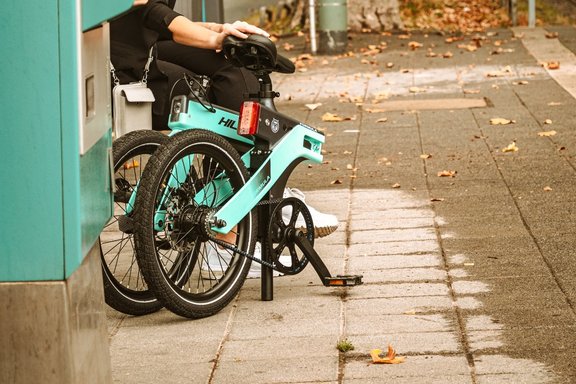 Cyclist waiting for bus